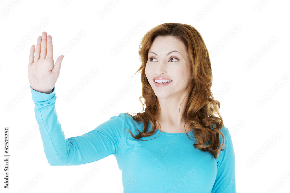 Beautiful woman making choose on abstract screen Beautiful woman making choose on abstract screen