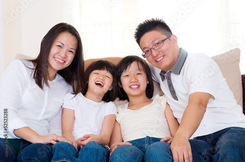 Asian family relaxed at home