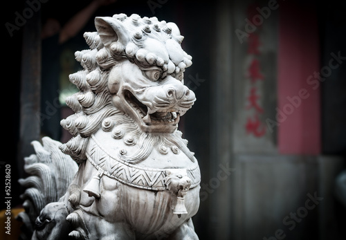 Stone sculpture of dragon in buddhist temple.