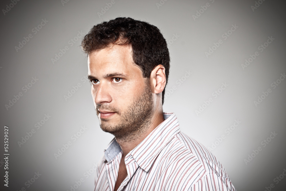 Portrait of a normal boy over grey background. Portrait of a normal boy over grey background.
