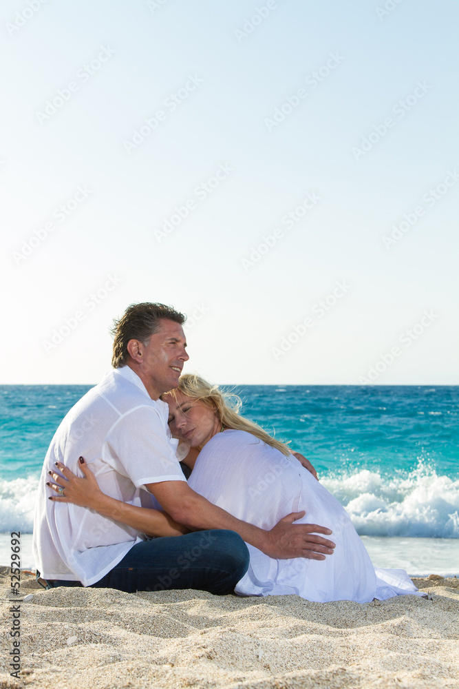 Happy mature couple on the beach