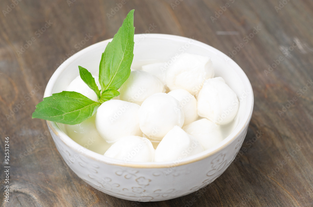 fresh mozzarella and basil in a bowl, close-up horizontal fresh mozzarella and basil in a bowl, close-up horizontal