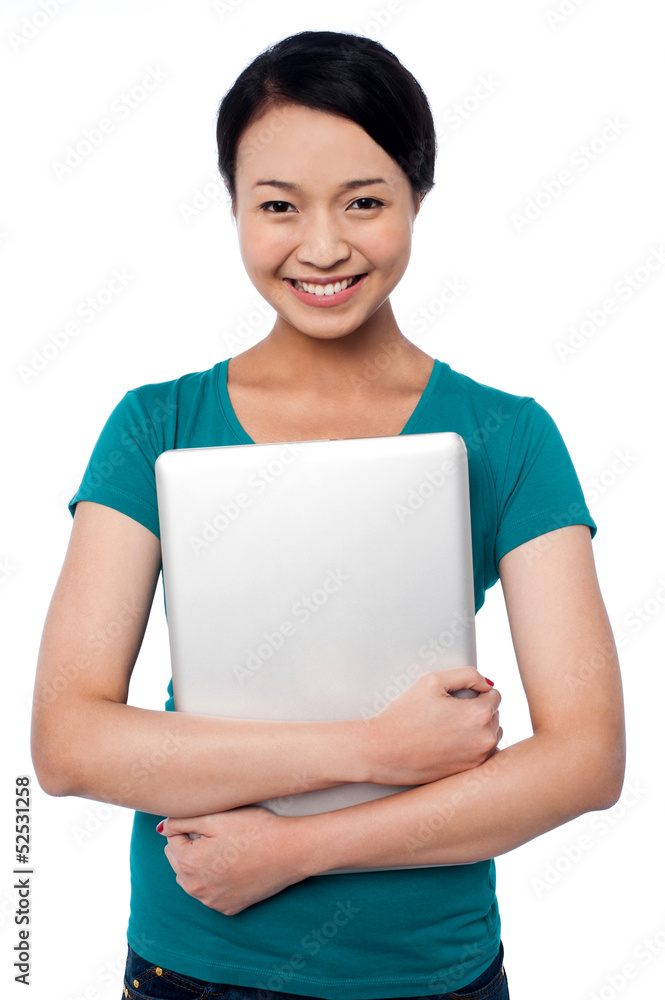 Smiling asian female posing with laptop Smiling asian female posing with laptop