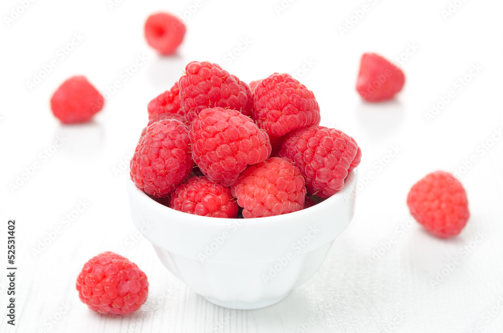 fresh raspberries in a white bowl, horizontal fresh raspberries in a white bowl, horizontal