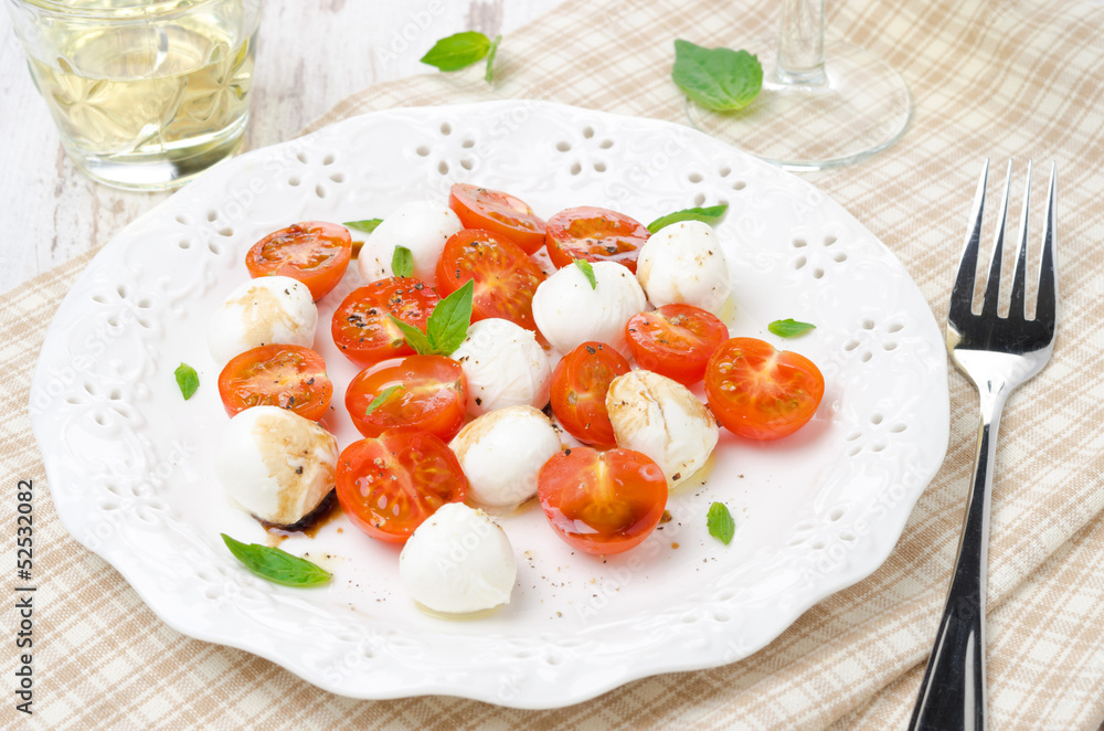 salad with mini mozzarella, tomatoes and fresh basil salad with mini mozzarella, tomatoes and fresh basil