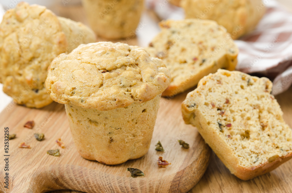 snack muffins with dried peppers and onions on a wooden board snack muffins with dried peppers and onions on a wooden board