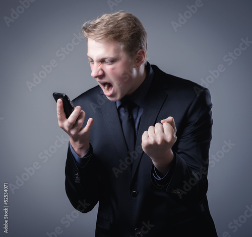 young businessman talking on a smartphone