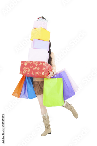 young woman running with gift box and shopping bags