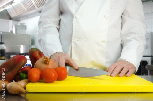 Chef hands cutting vegetables
