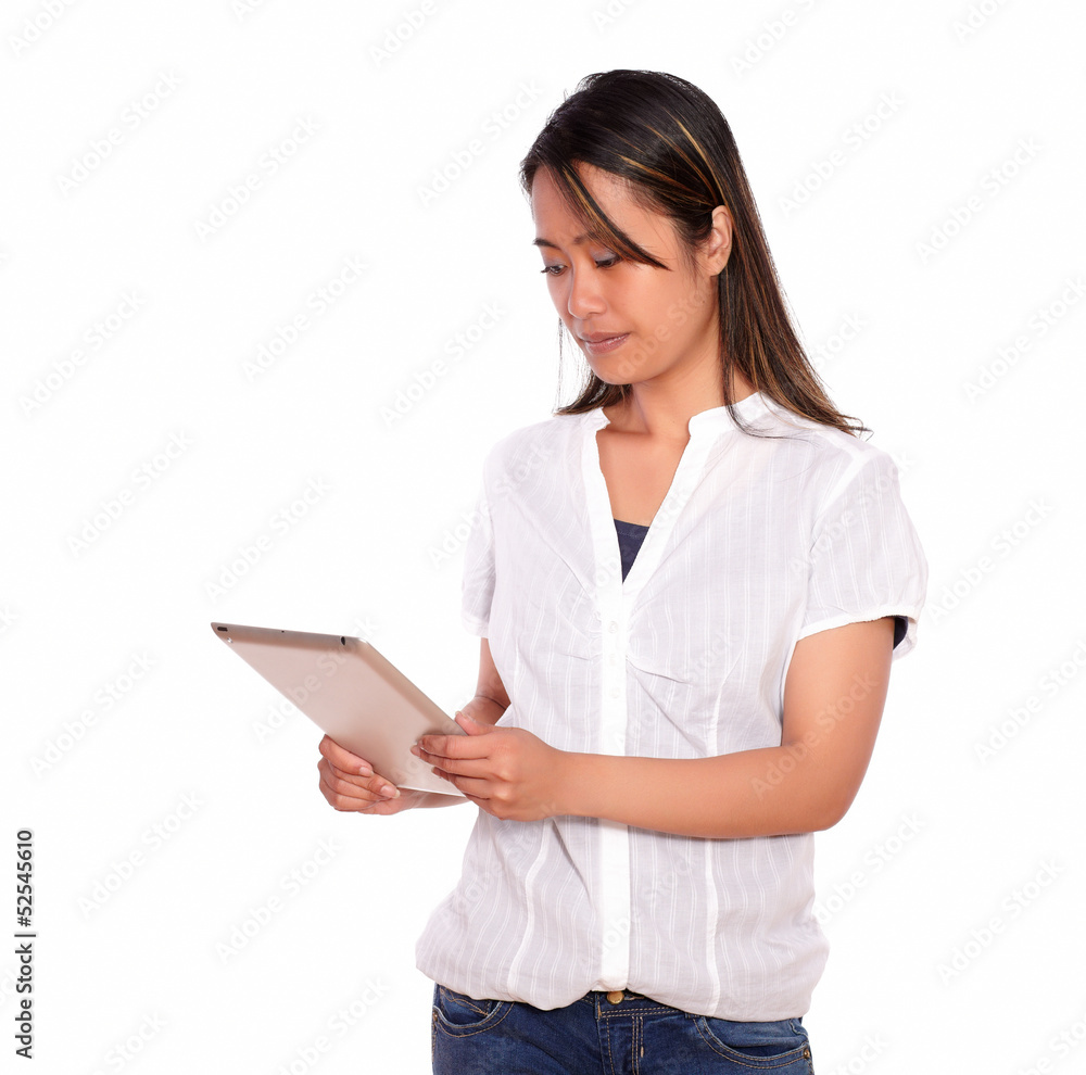 Charming young woman reading on tablet pc screen Charming young woman reading on tablet pc screen