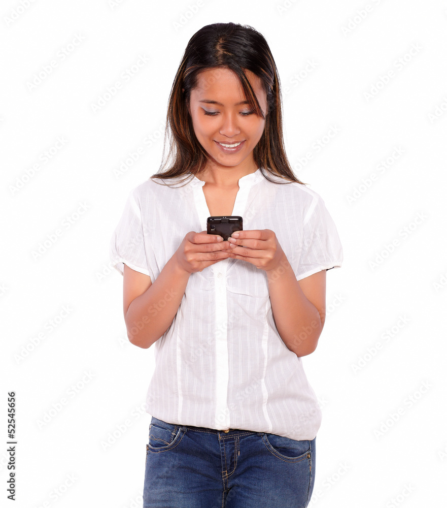 Asiatic charming young woman sending a message Asiatic charming young woman sending a message