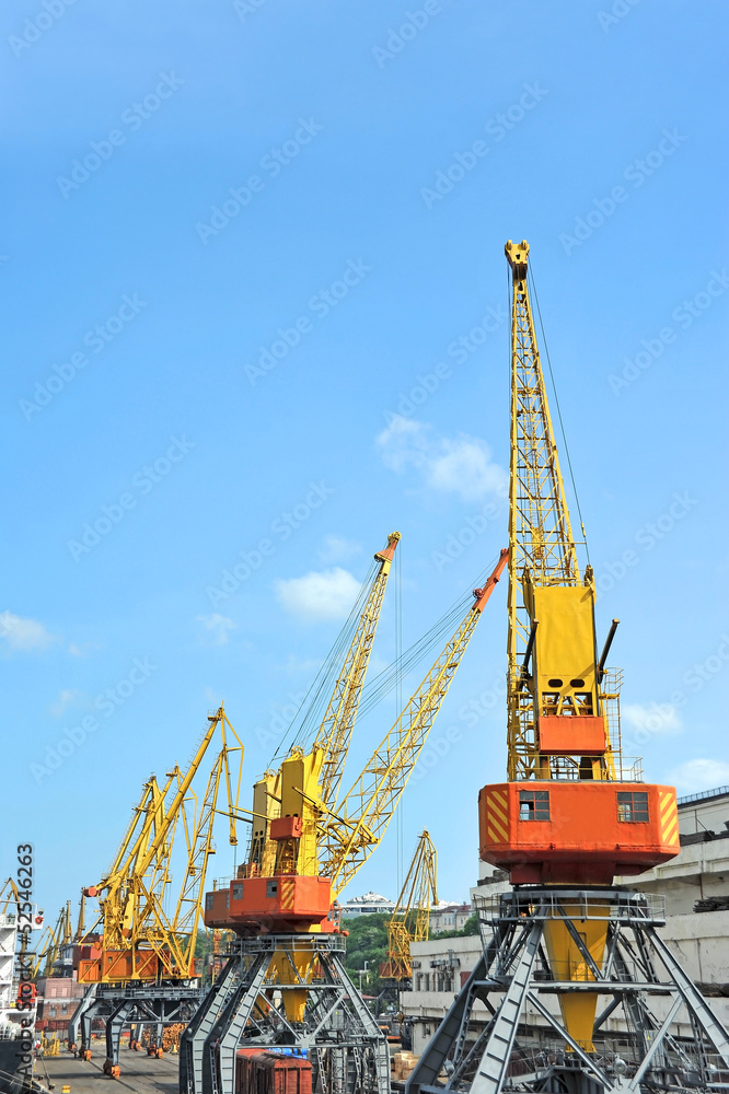 Cargo crane and freight traine in port Cargo crane and freight traine in port