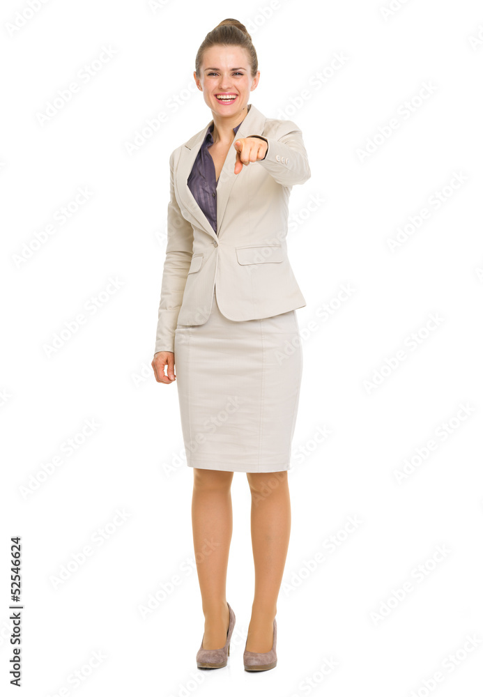 Full length portrait of happy business woman pointing in camera Full length portrait of happy business woman pointing in camera