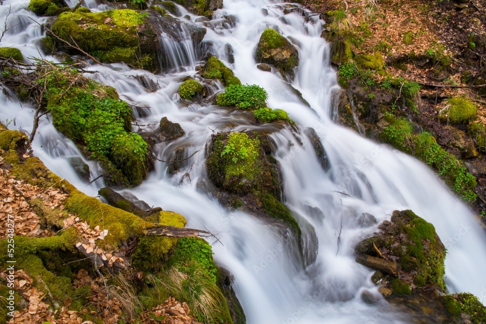 Fast little river in mountain forest Fast little river in mountain forest