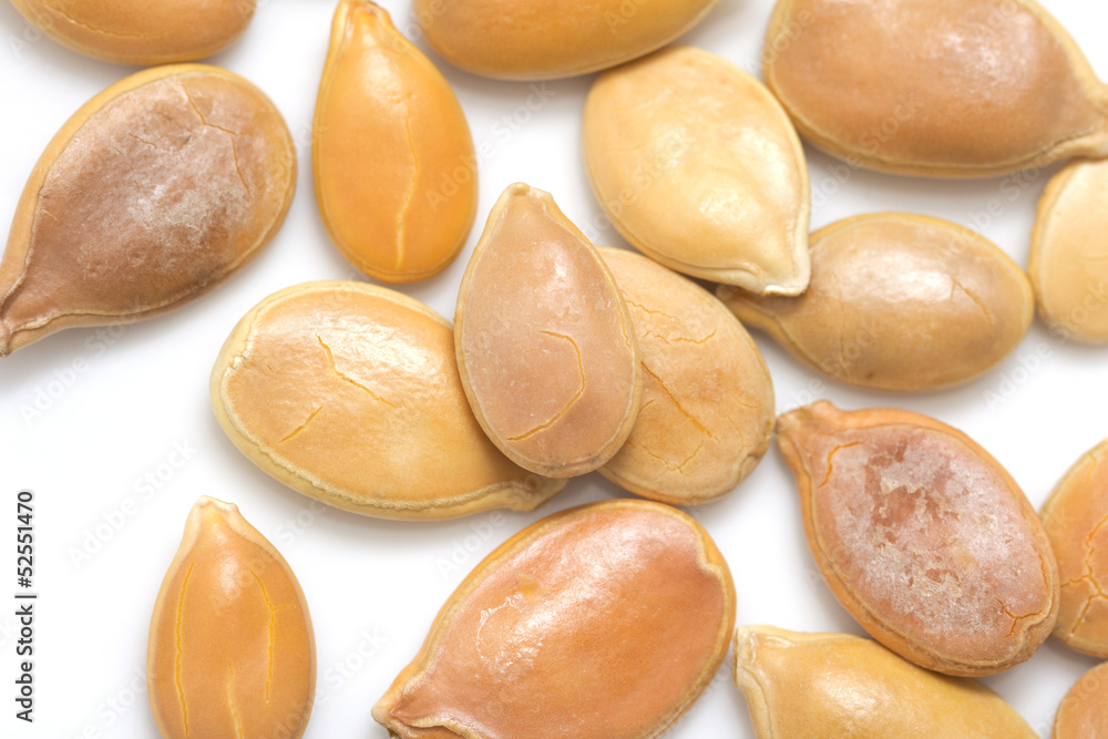 Obraz premium Pumpkin seeds on a white background. macro