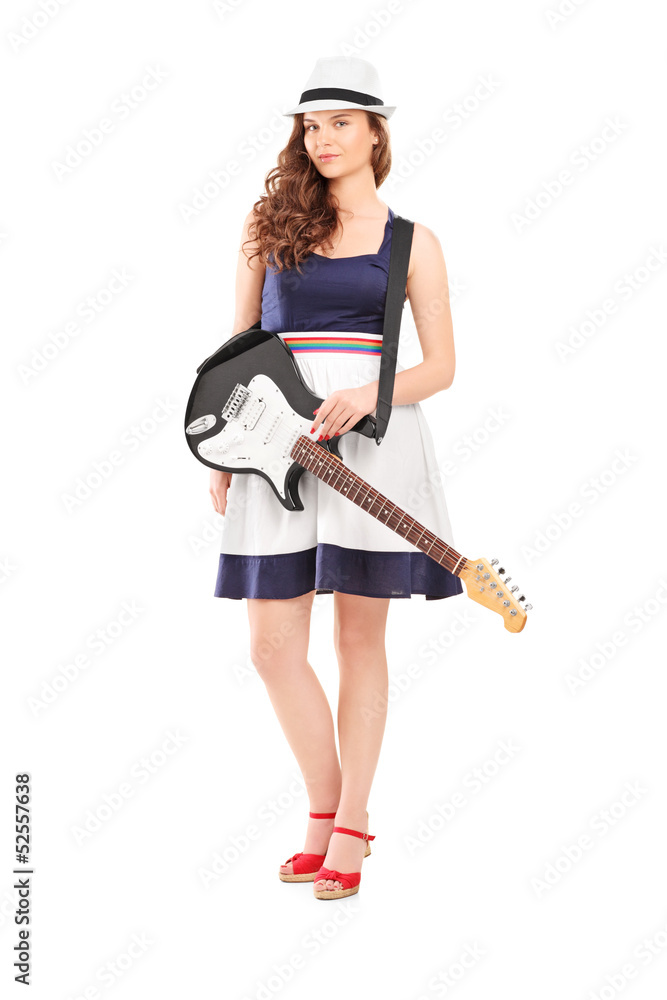 Full length portrait of a female with an electric guitar Full length portrait of a female with an electric guitar