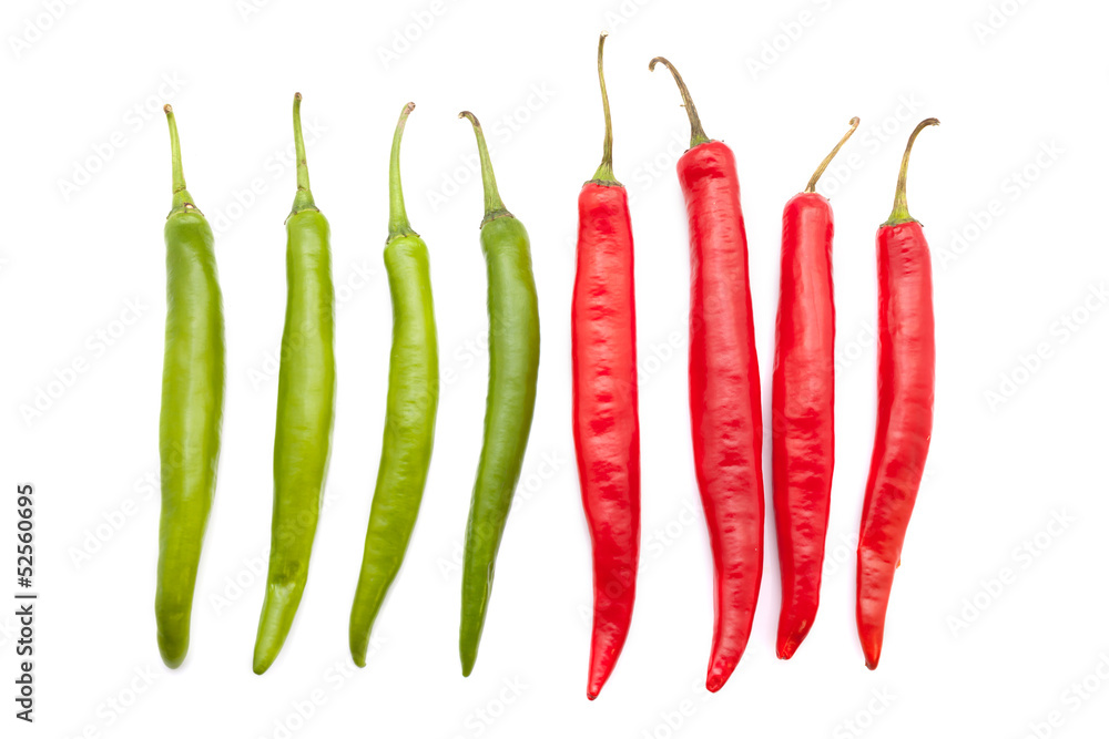 Red and green chili peppers isolated on the white Red and green chili peppers isolated on the white