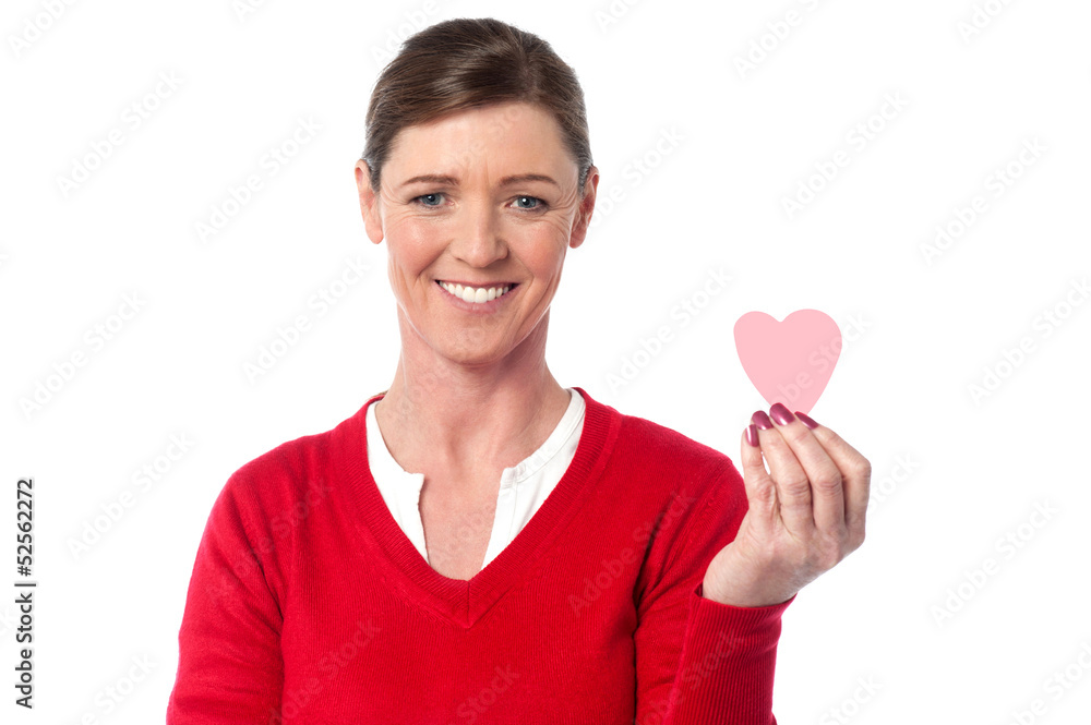 Woman showing cute paper heart to camera Woman showing cute paper heart to camera