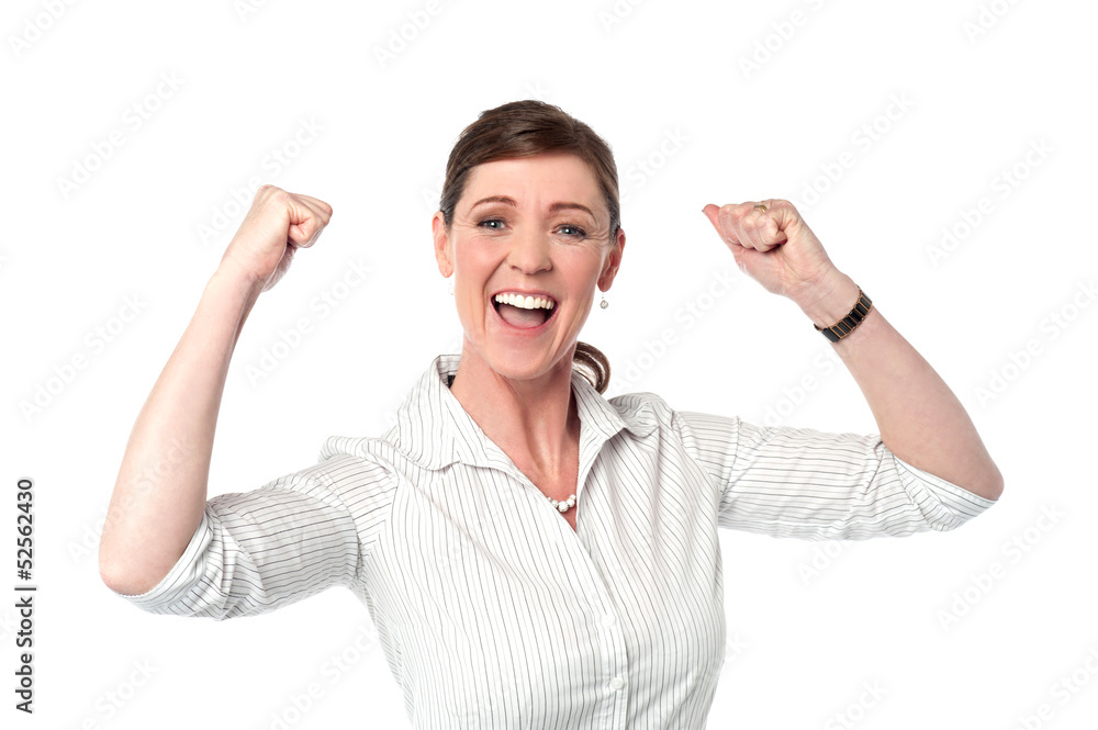 Excited corporate lady with clenched fists Excited corporate lady with clenched fists