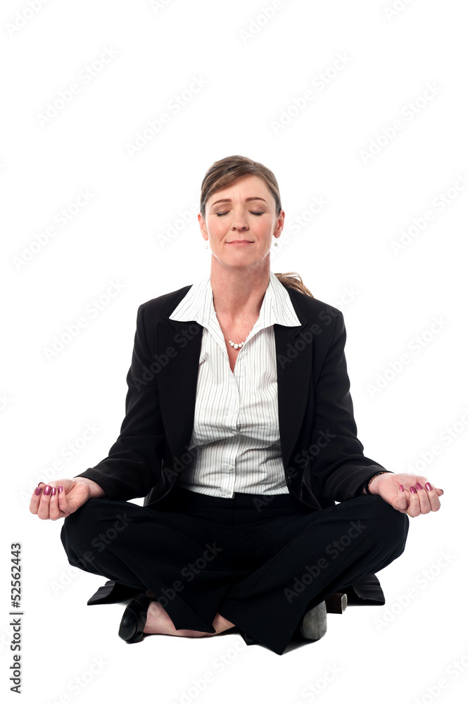 Middle aged doing meditation, lotus pose Middle aged doing meditation, lotus pose