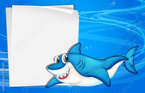 An empty paper under the sea beside a shark
