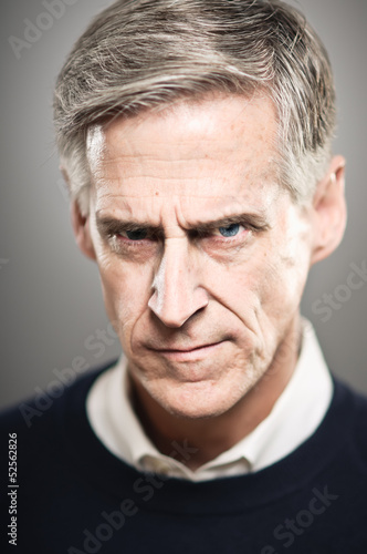Mature Caucasian Man With An Angry Stare