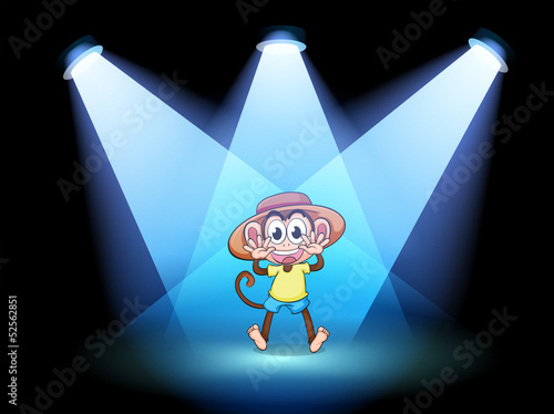 A happy monkey at the center of the stage