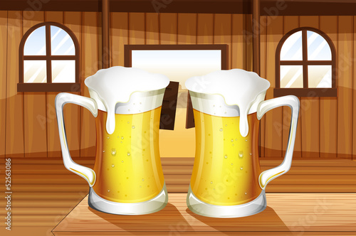 A table with two mugs of beer