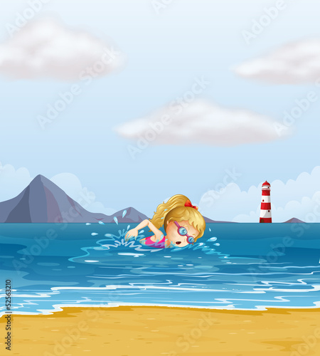 A girl swimming at the sea with a beacon at the back