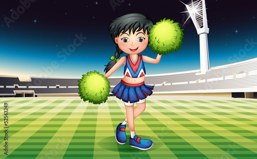 A cute girl with green pompoms