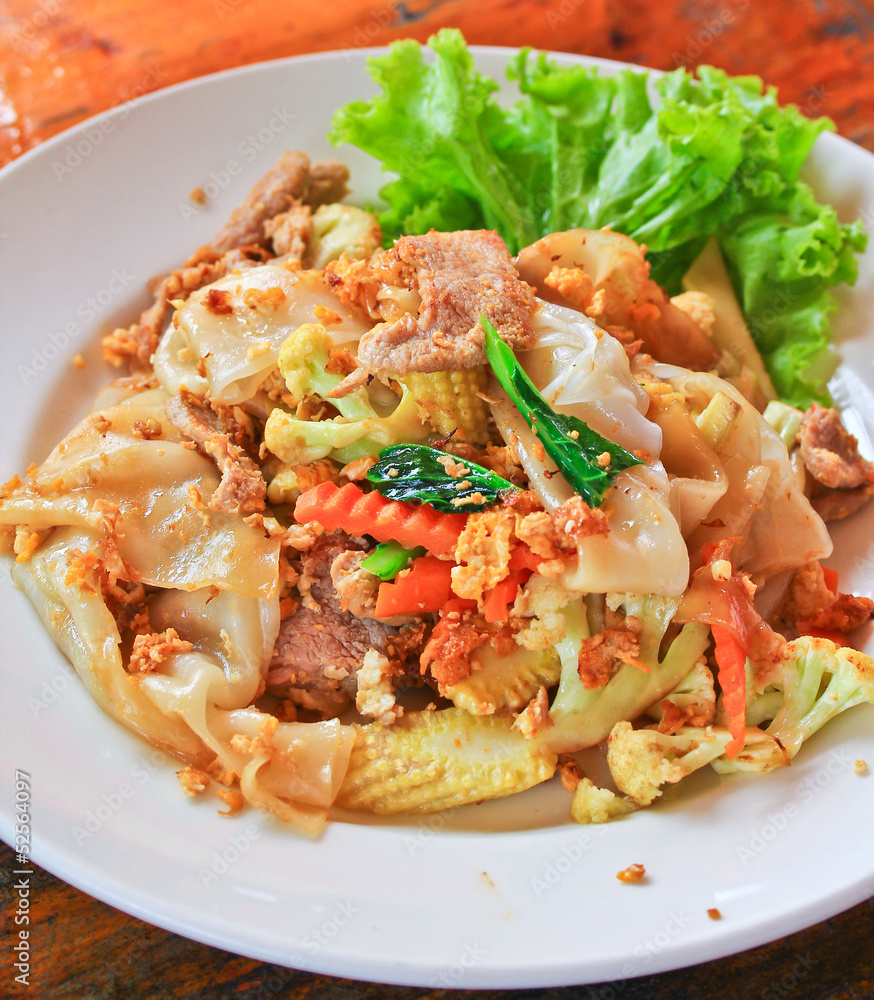 Stir fried noodles with egg, pork, vetgetables and sweet sauce Stir fried noodles with egg, pork, vetgetables and sweet sauce