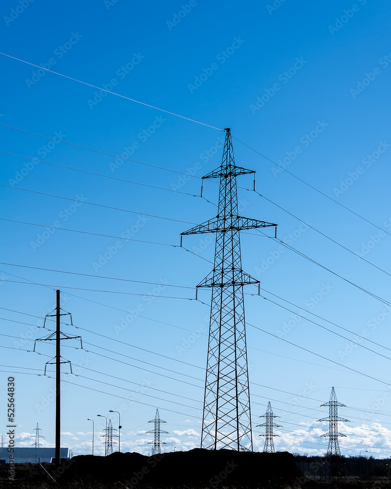 Transmission power towers at sunset