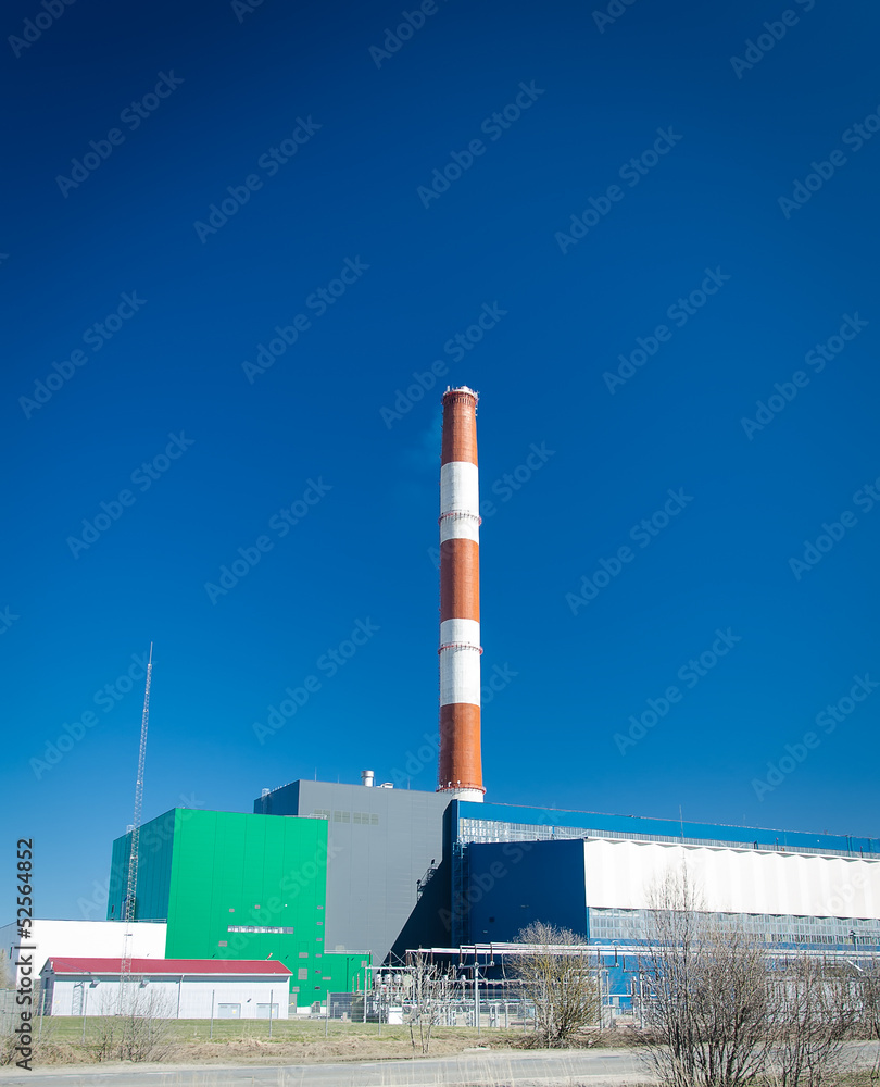 Electric power plant over blue sky.