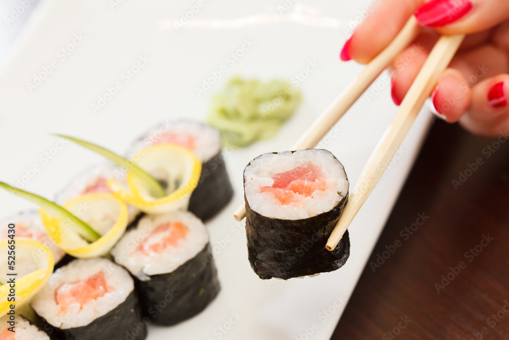 sushi with chopsticks sushi with chopsticks