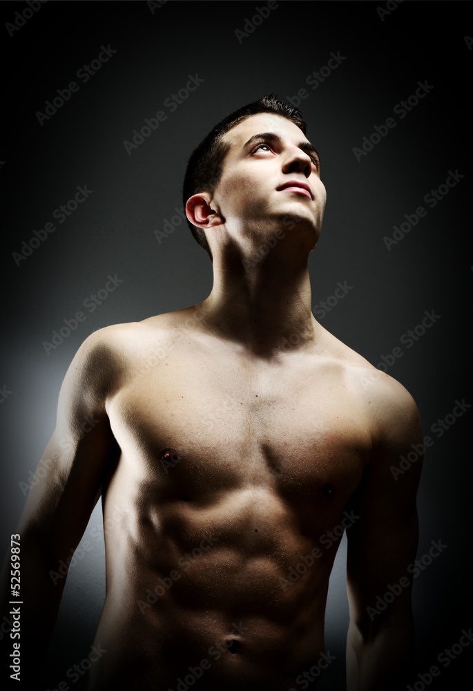 Young sexy muscular man posing