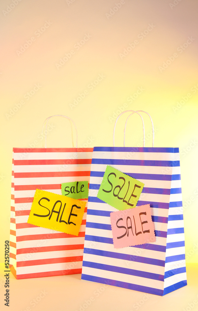 Fototapeta premium Striped bag on yellow background