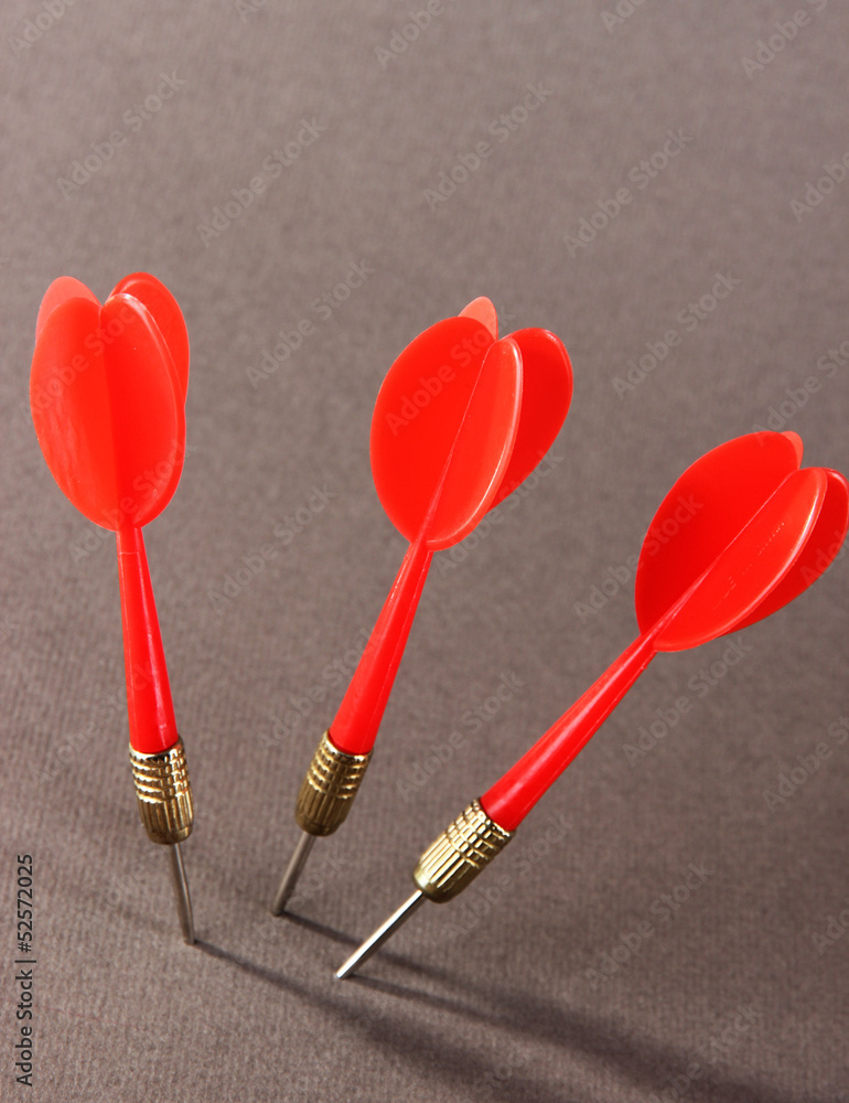 Darts on gray background Darts on gray background