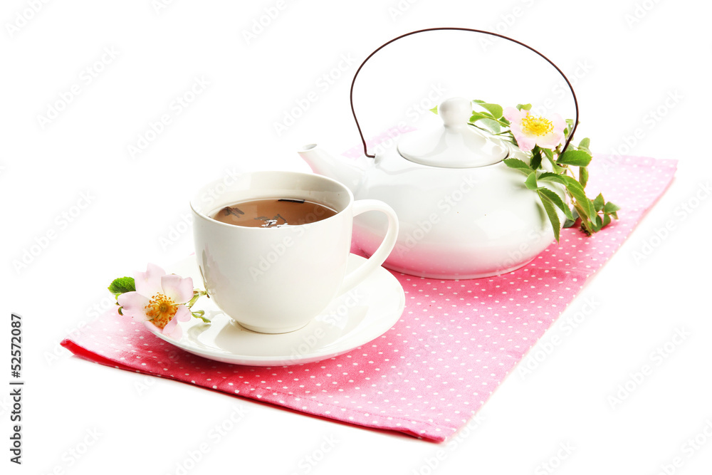 Fototapeta premium Cup and teapot of herbal tea with hip rose flowers, isolated