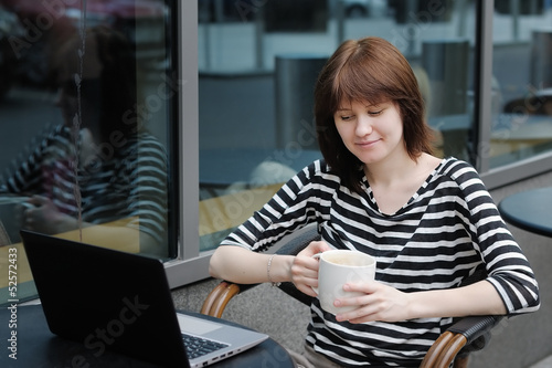 Girl in a outdoor cafe