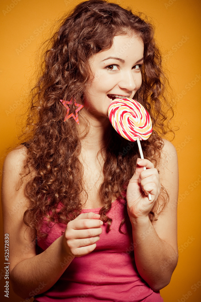 happy young woman with lollipop 
