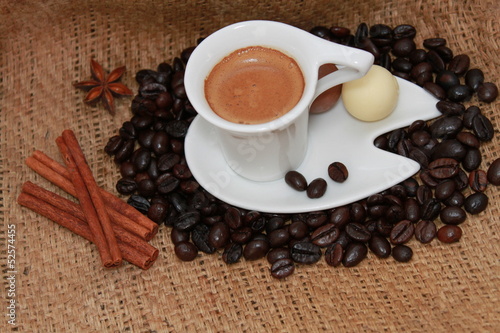 Cup of coffee, cinnamon sticks and star anise