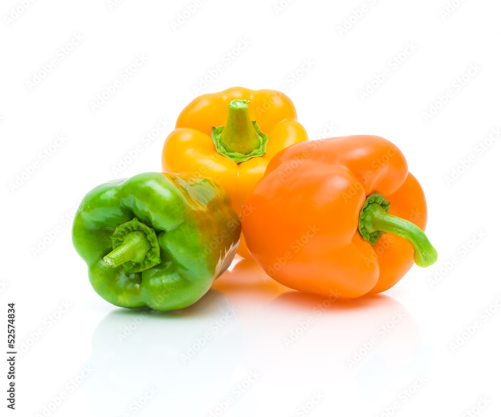 ripe sweet peppers on white background with reflection closeup ripe sweet peppers on white background with reflection closeup