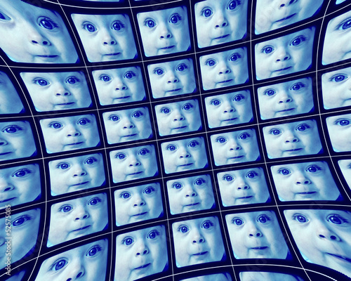 Fotografie Distorted blue video screens showing the face of a baby