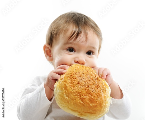 Baby eating bun bread