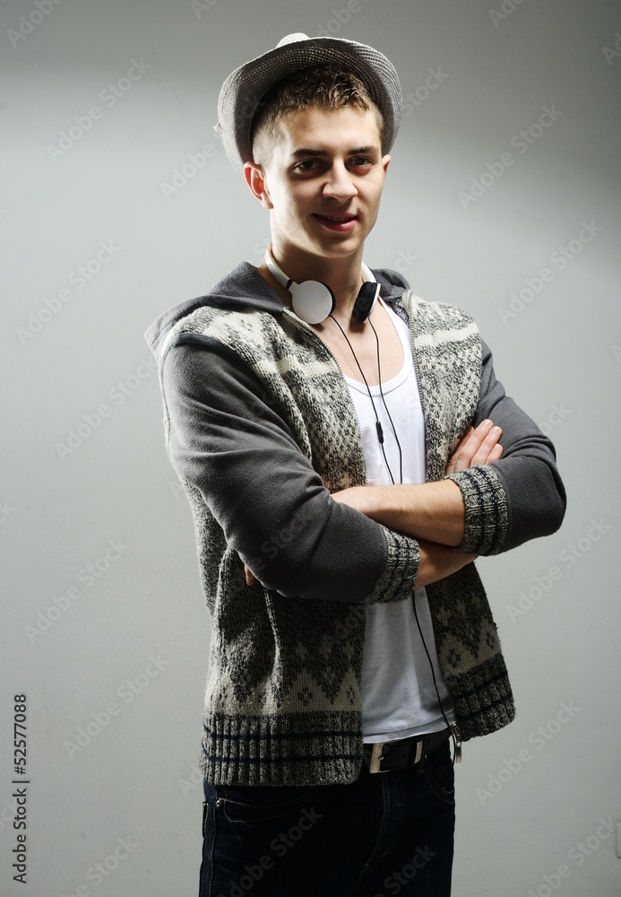 Fototapeta premium Man with hat - Young male in white t-shirt and jeans isolated on