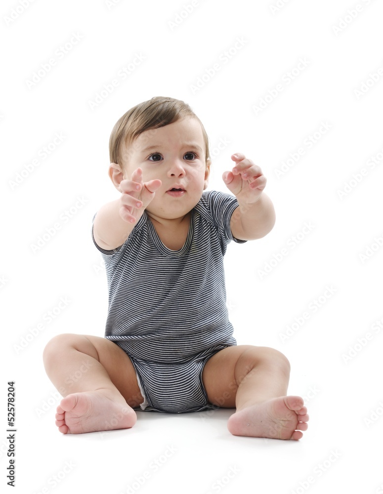 Baby is sitting on floor, isolated on white Baby is sitting on floor, isolated on white