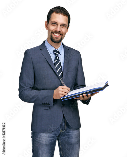 Cheerful smiling businessman writing on clipboard isolated