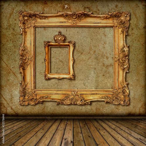 interior with vintage golden frame on the wall photo