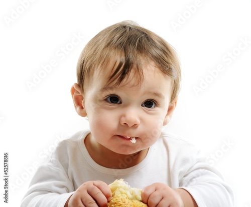 Baby eating bun bread