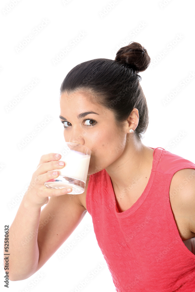 Model Released. Young Woman Drinking a Glass of Milk Model Released. Young Woman Drinking a Glass of Milk